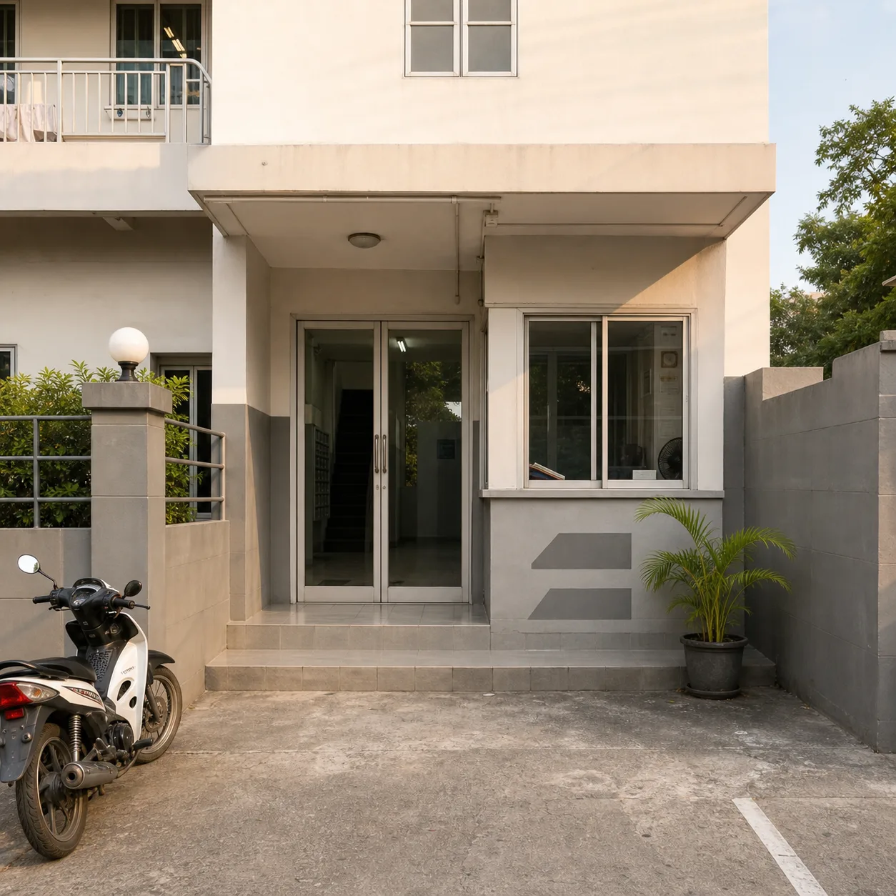 The building entrance from the street, with the guard post and keycard door