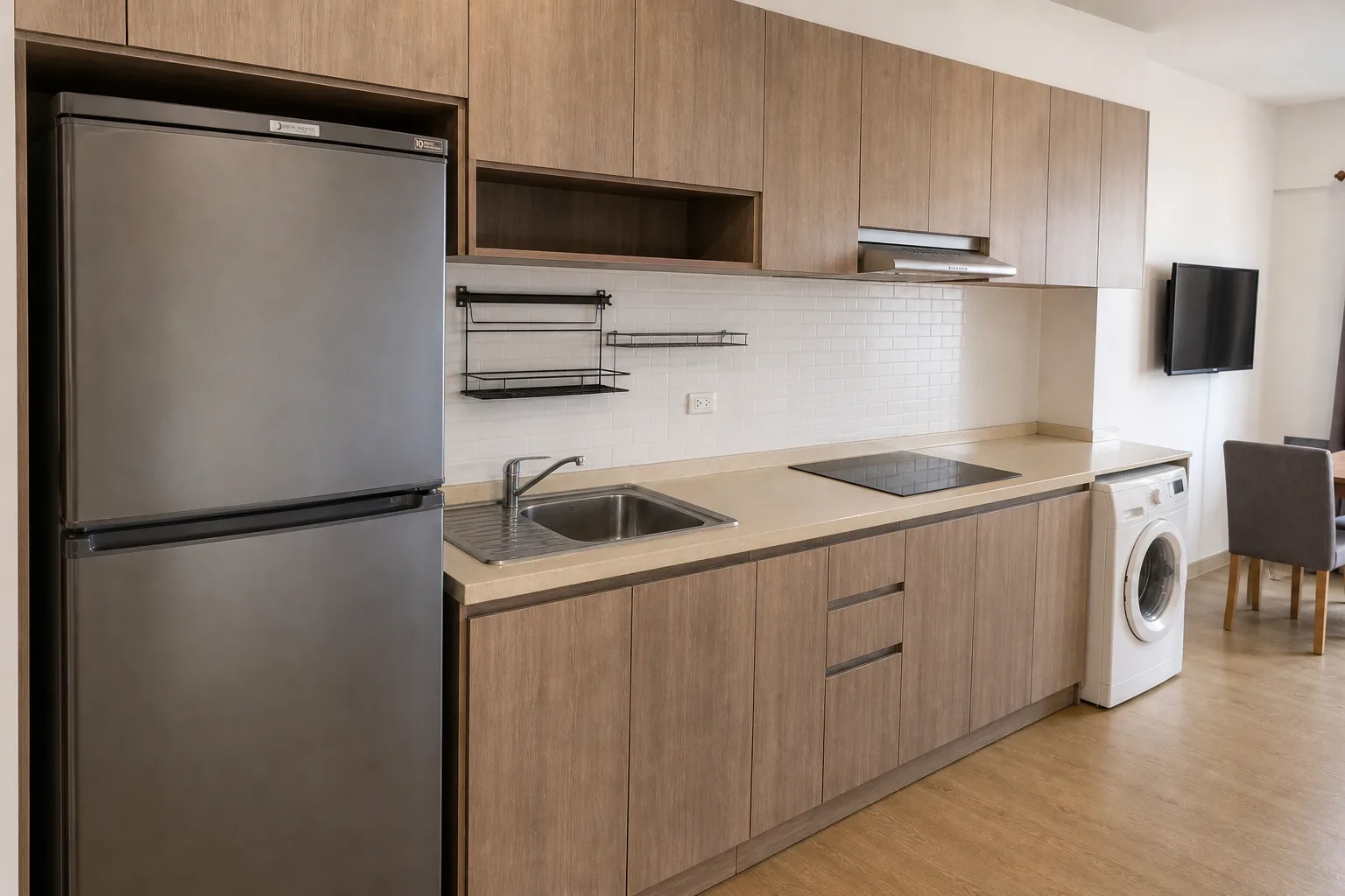 The kitchenette in the two bedrooms, with sink, induction hob and counter storage